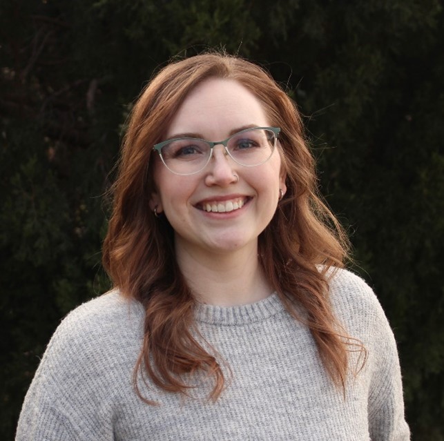 female smiling with glasses on