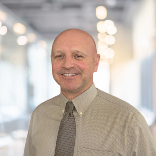 man smiling for a headshot