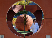Doctor walking through sculpture