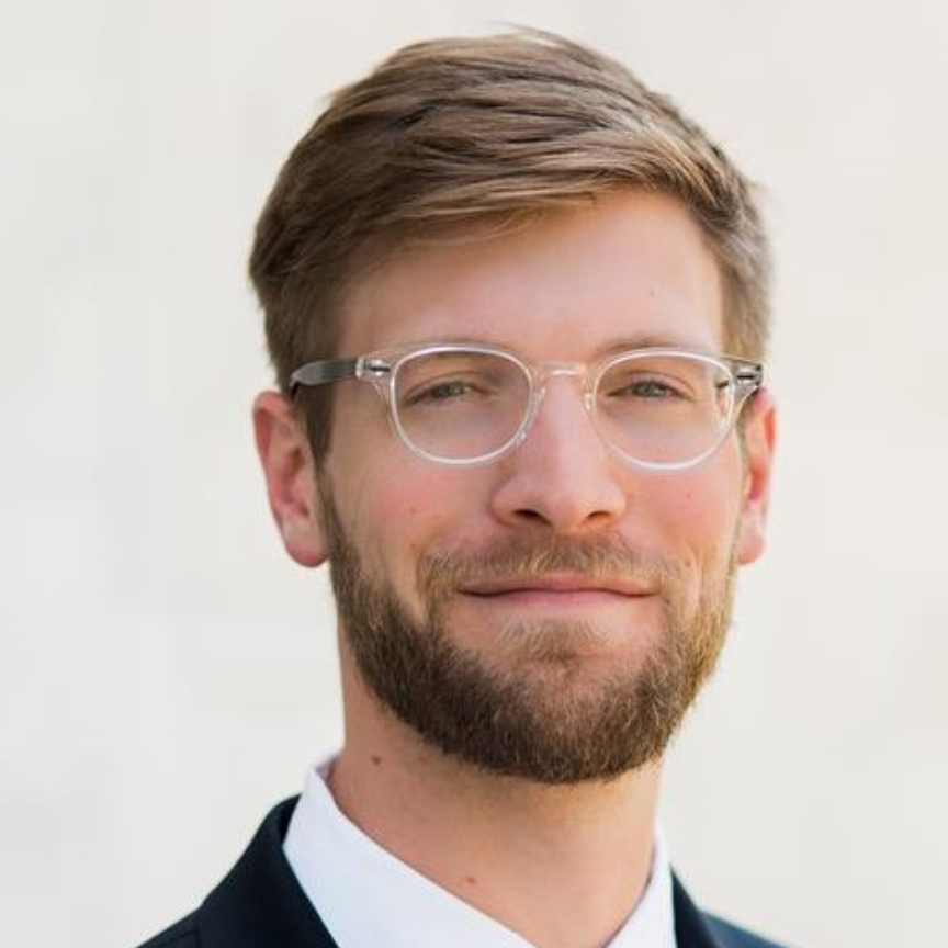 male doctor smiling for a headshot