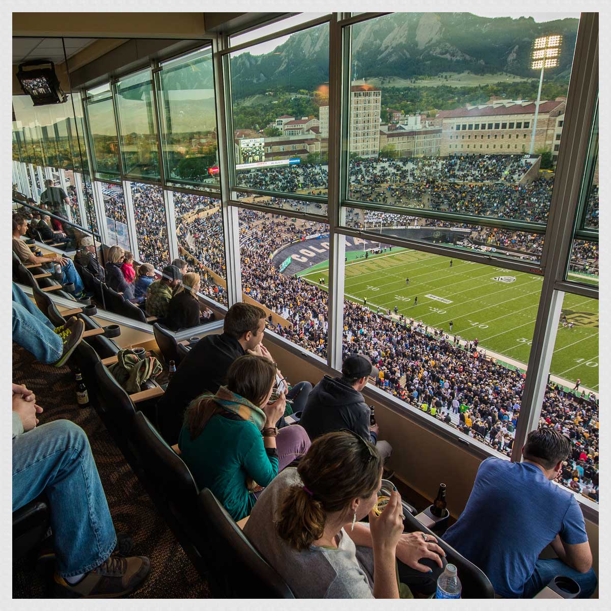 Stadium Club event space with floor-to-ceiling windows overlooking Folsom Field