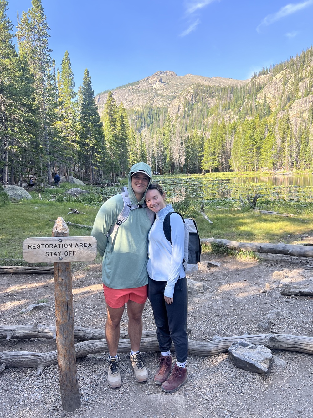 Dr. Guerrina next to a person at an alpine restoration area.