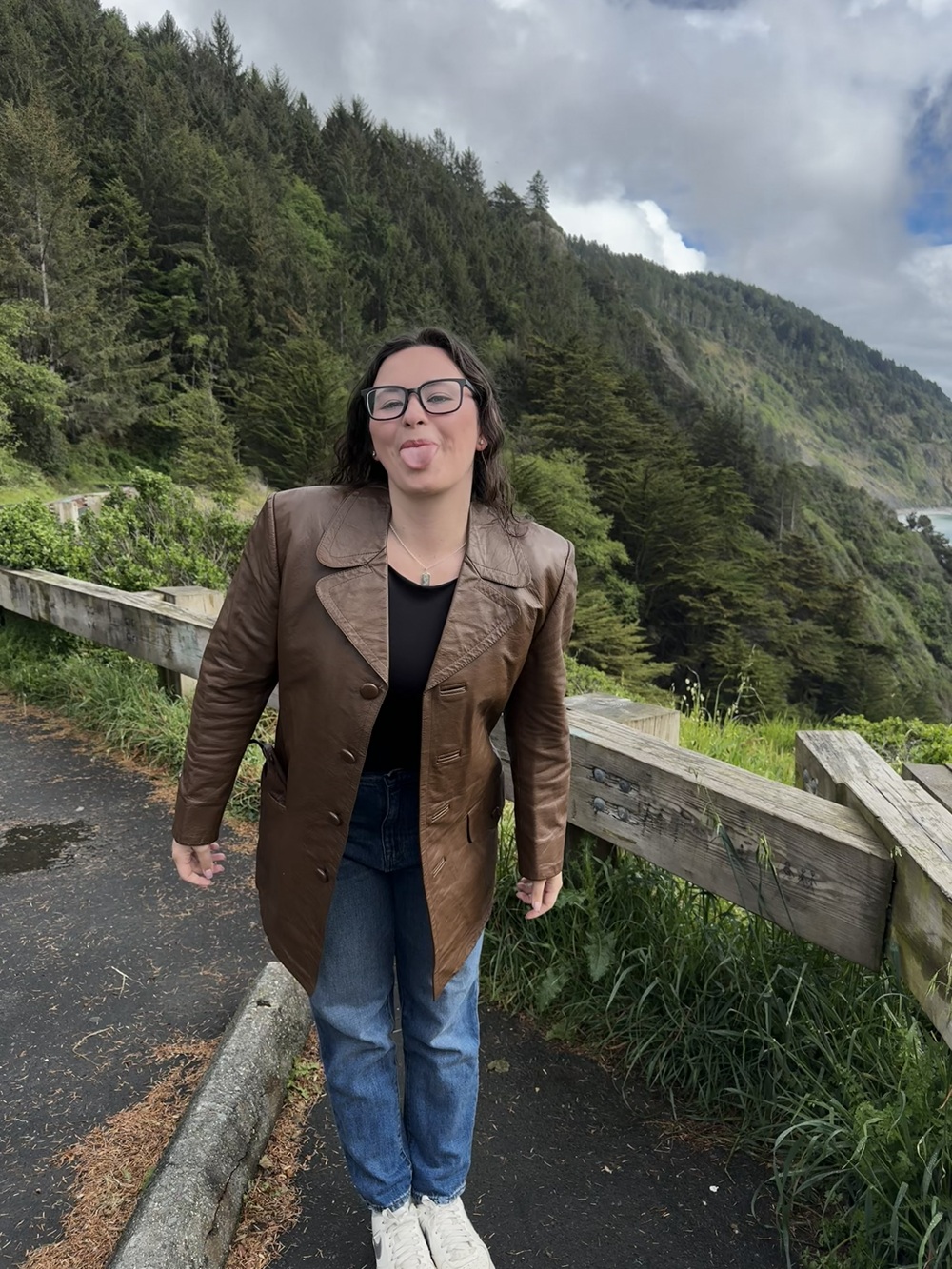 Dr. Nagayama in the mountains sticking her tongue out.