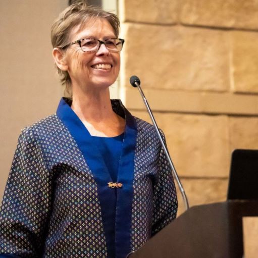 Photo of Kenda Fuller speaking at a podium.