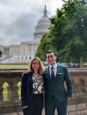 Two doctor of physical therapy students standing in front of the US Capitol.
