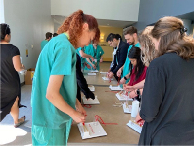 2022-23 Interns 7/18/22 during suture lab with Dr. Tom Robinson and Dr. Teresa Jones