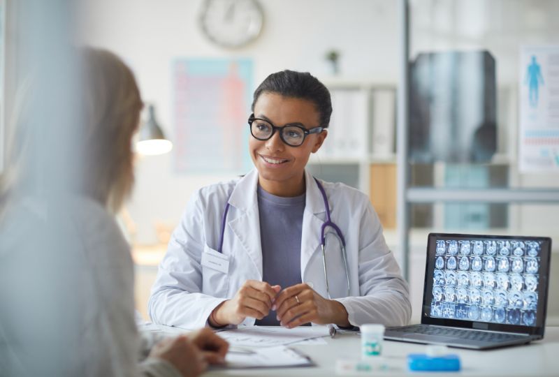 A doctor speaking with a community member.