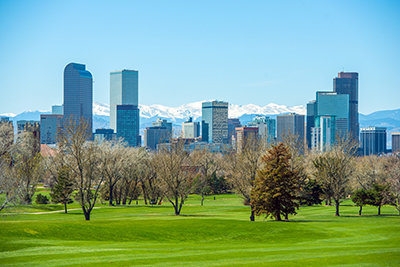 downtown denver with mountain background. Shot from park to the east