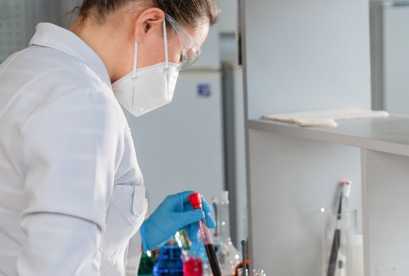 A doctor conducting research with test tubes.