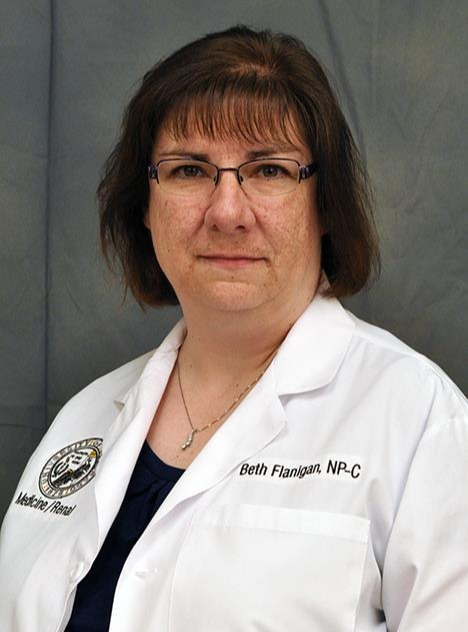 Professional Headshot of woman in lab coat