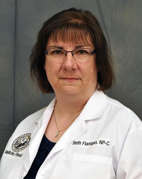 Professional Headshot of woman in lab coat
