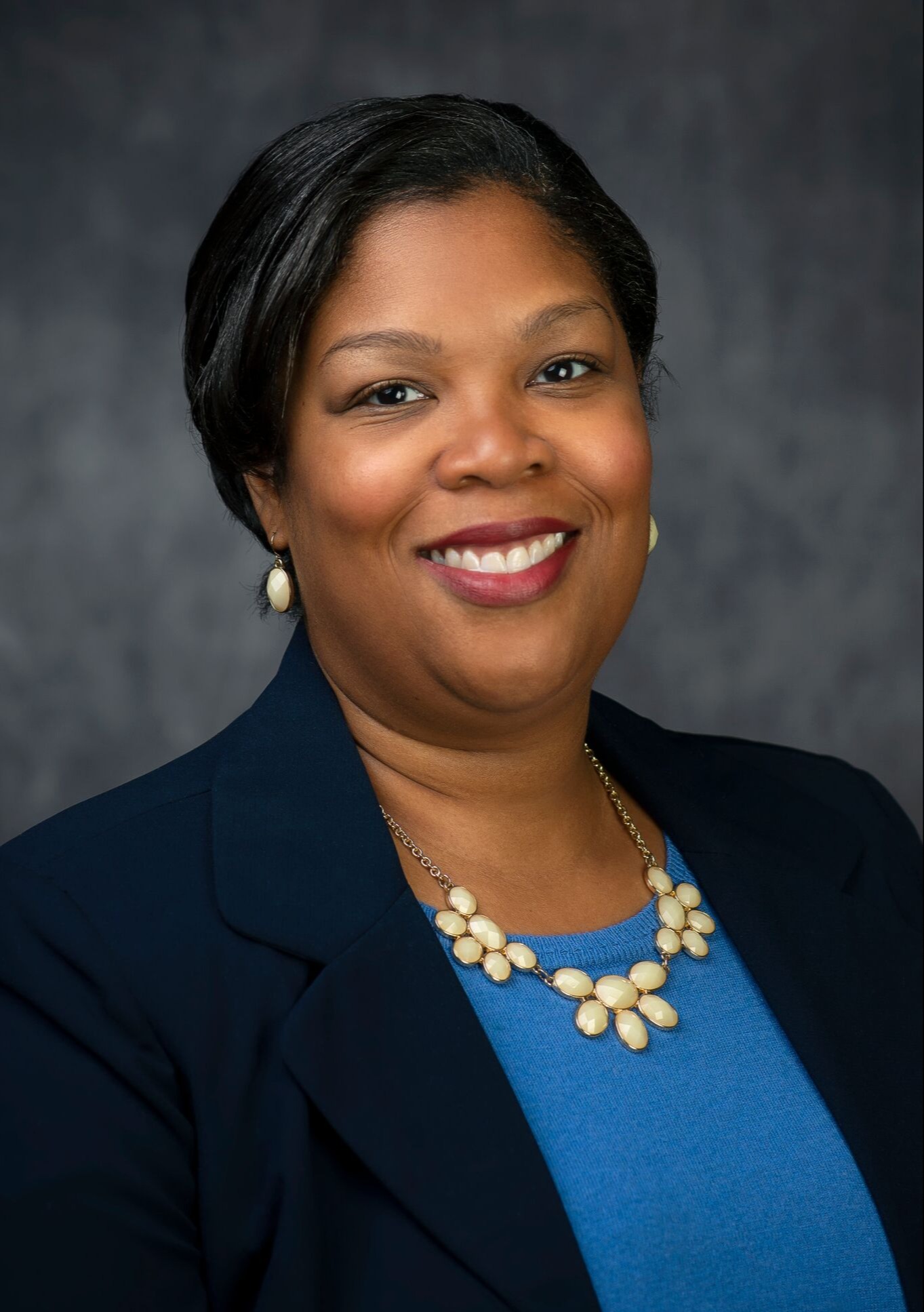 Professional headshot of woman in a suit