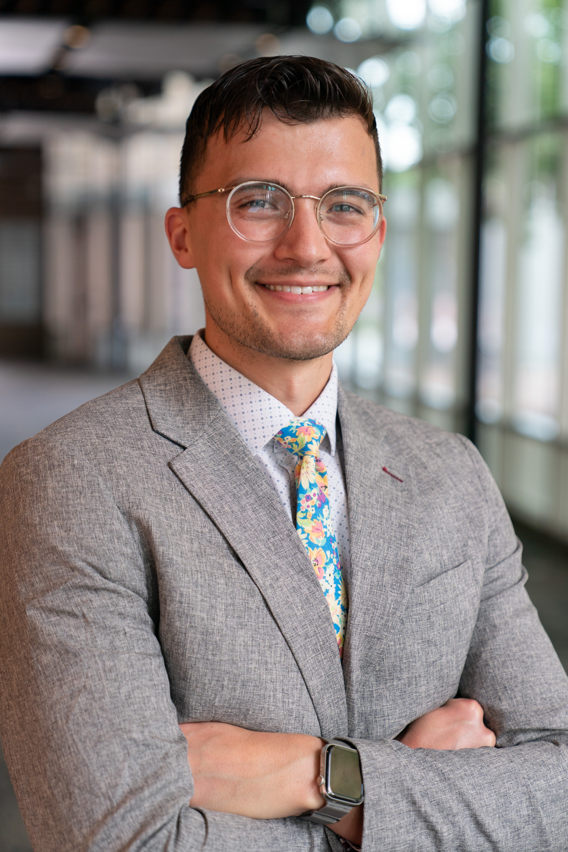 Professional headshot of man in suit.