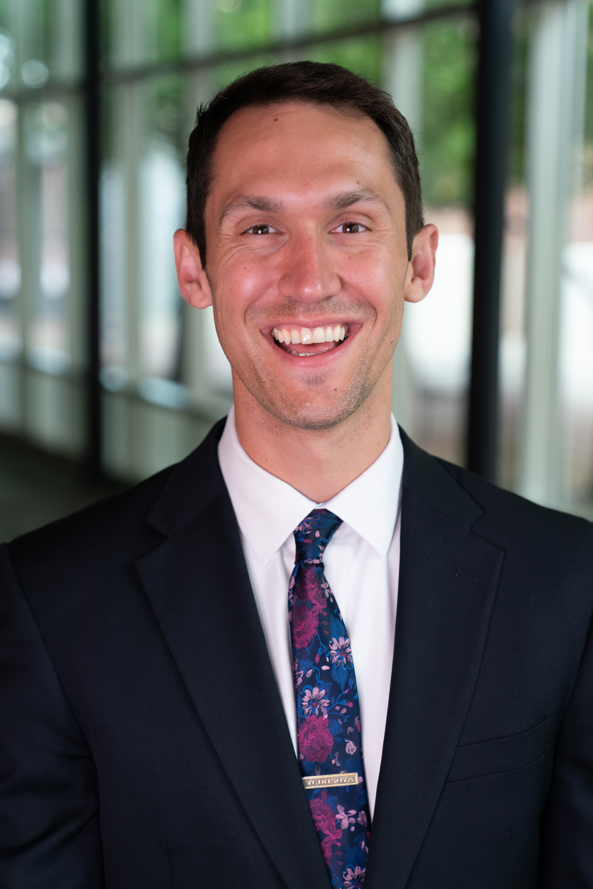 professional headshot of person in suit