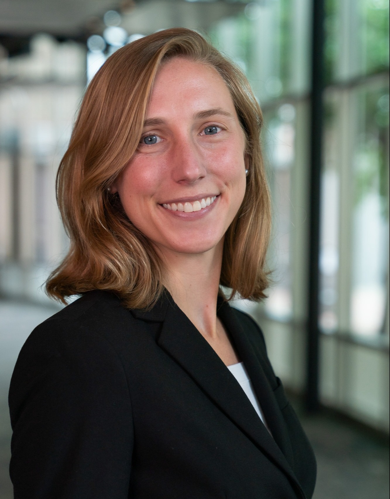 professional headshot of woman in blazer