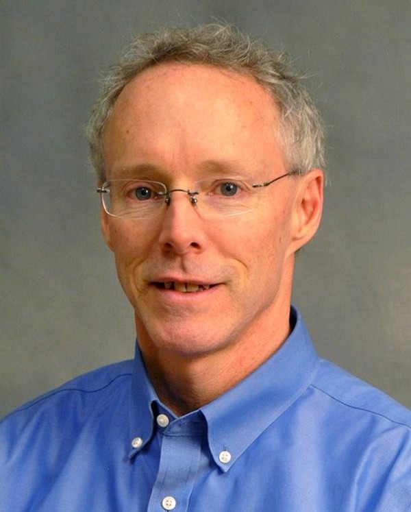 Professional headshot of man