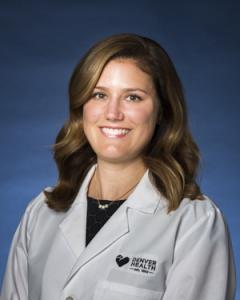 Professional headshot of woman in lab coat