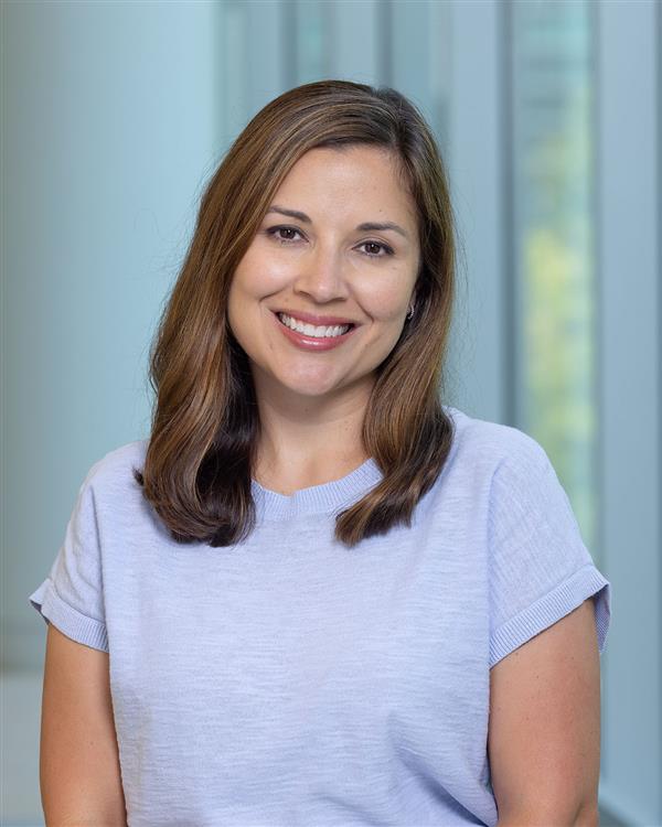 Professional headshot of a women smiling
