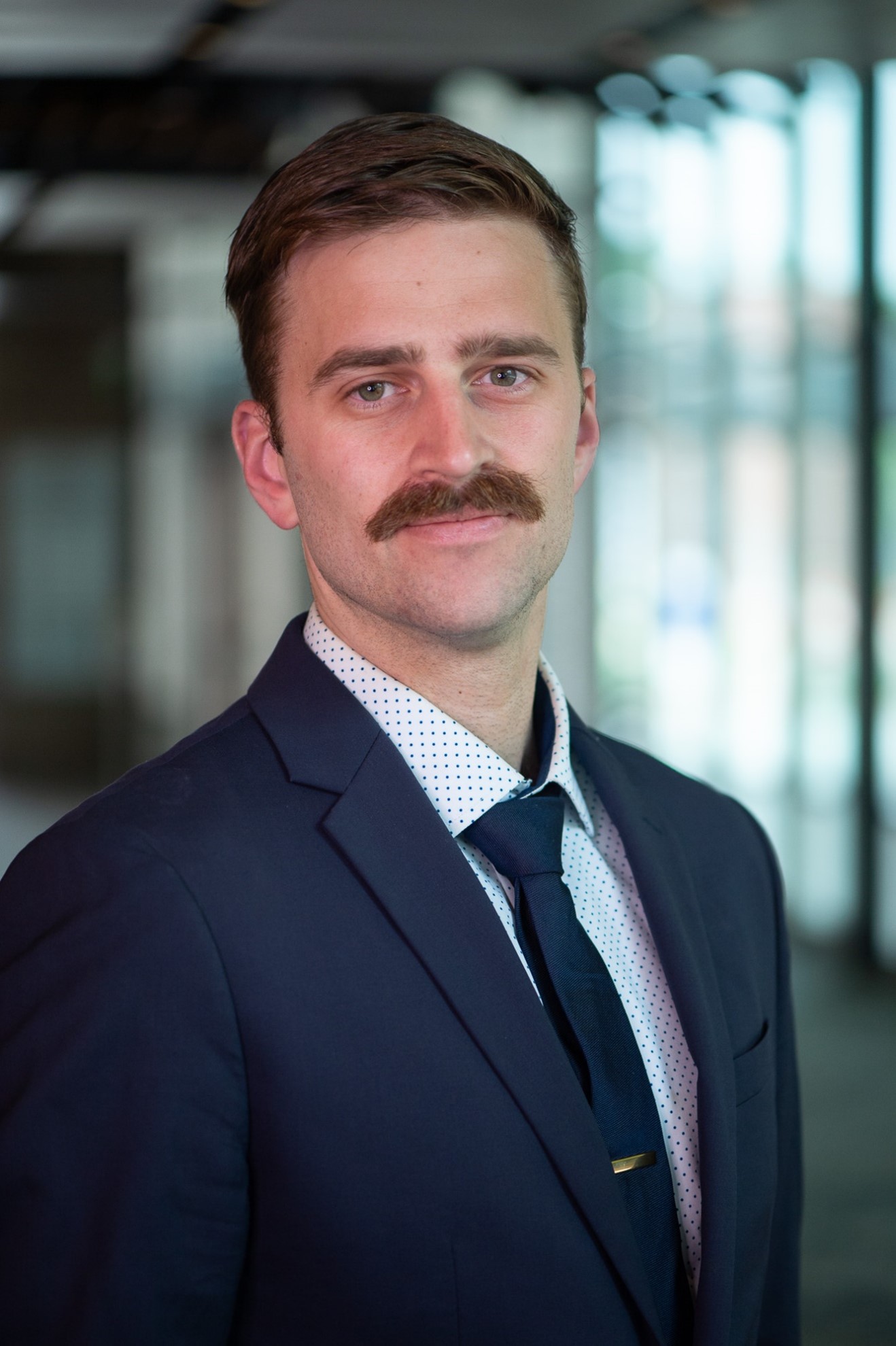 headshot of man in suit