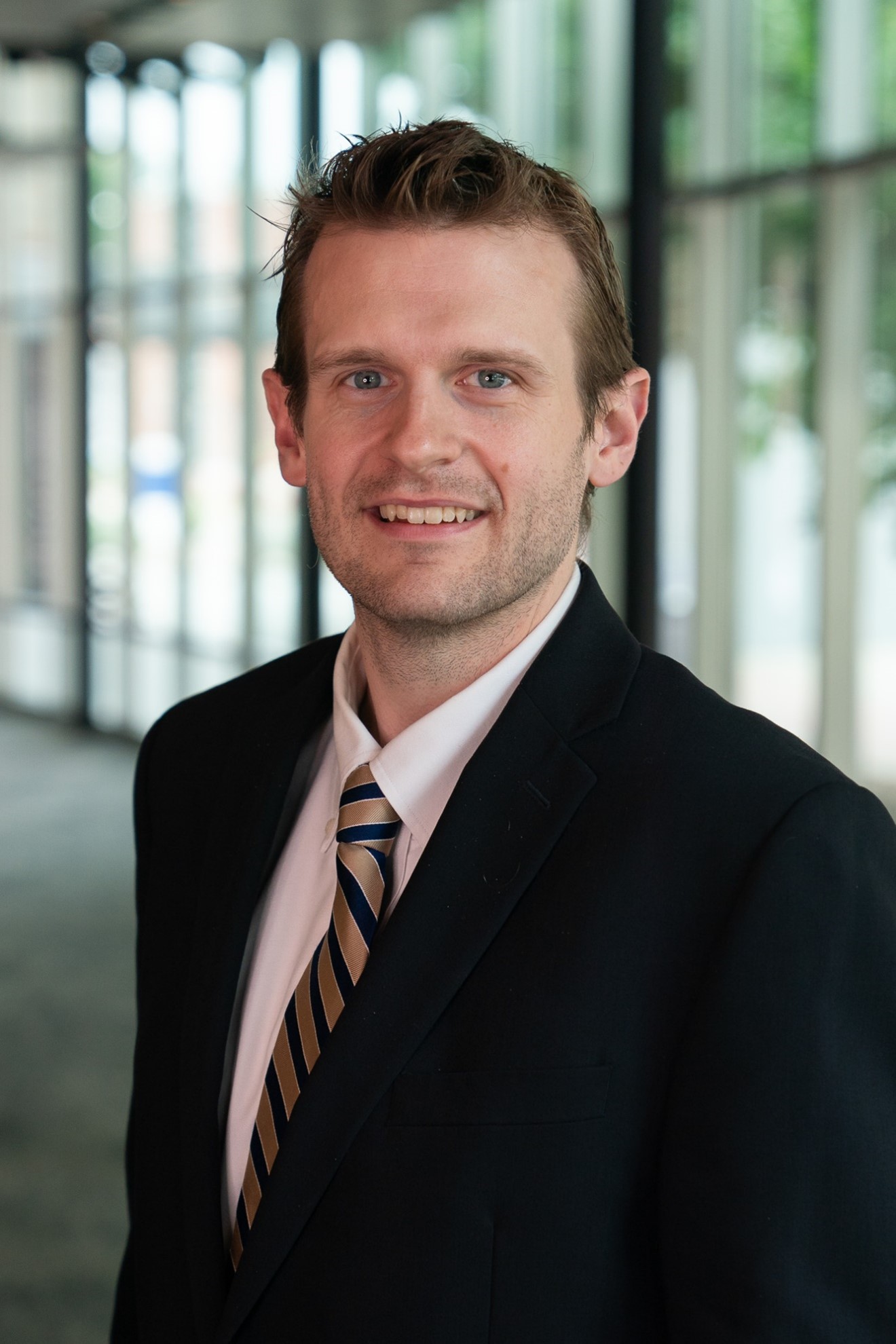 headshot of man in suit