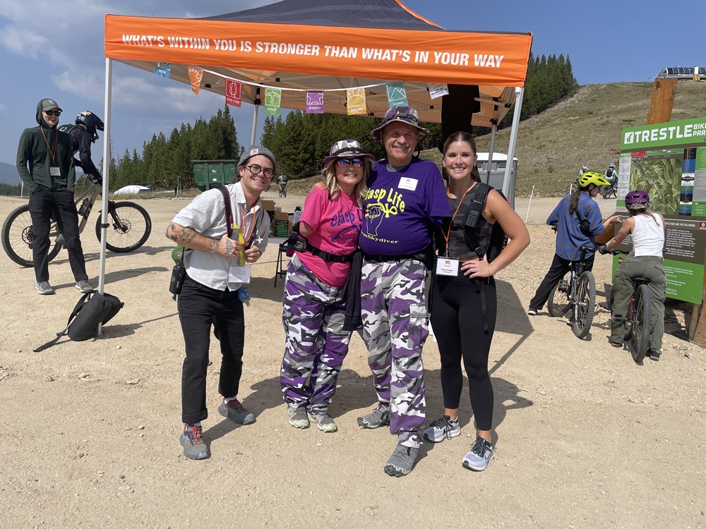 Students and community members standing at a tent in Winter Park.