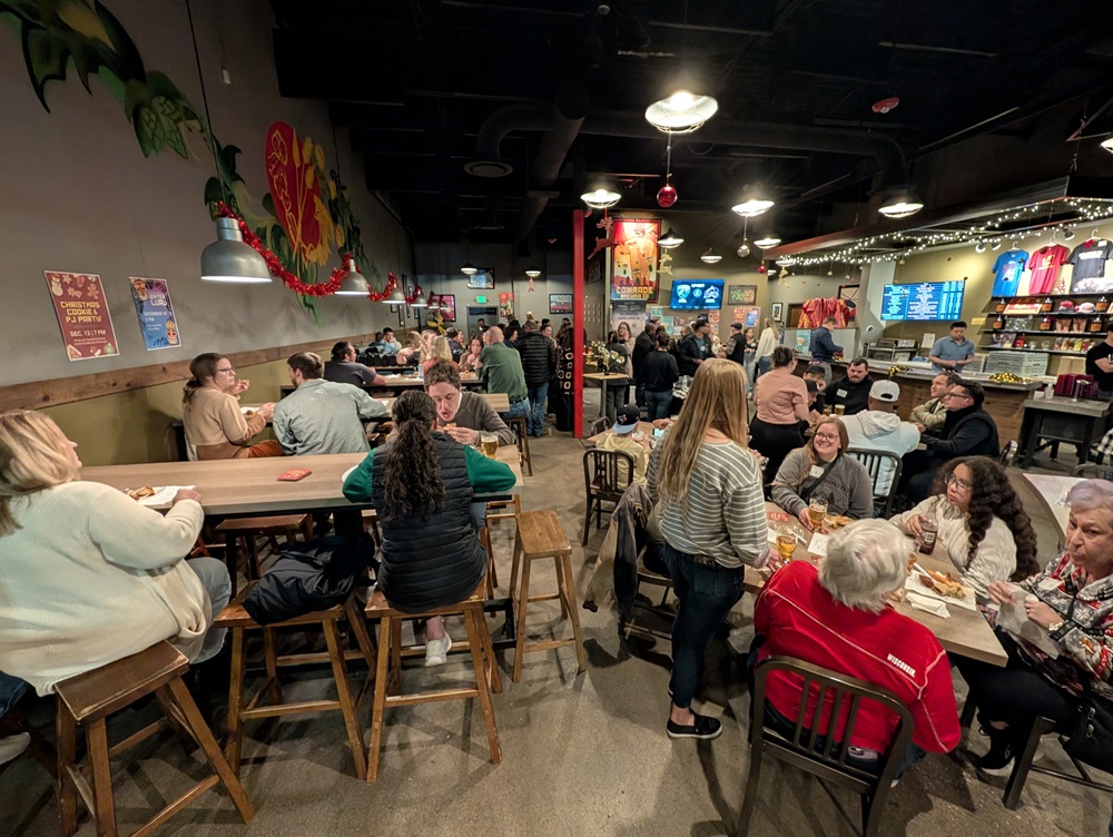 A group of students and their families gathered at Comrade Brewing for the graduation party.