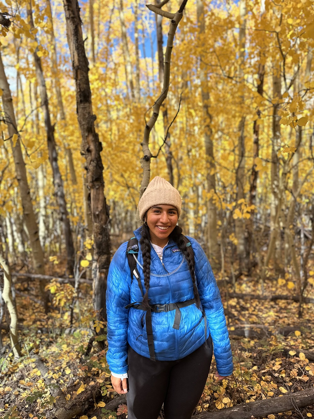 Photo of Zabrina surrounded by fall foliage.