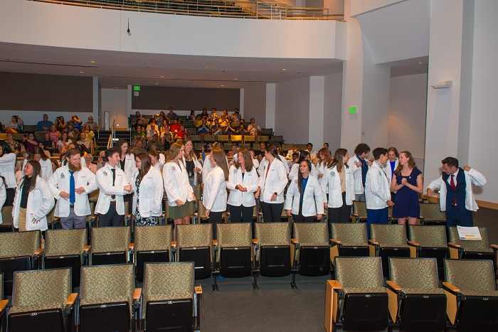 Students in the Residential Pathway wearing their white coats.
