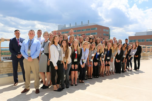 Group photo of PA students on a campus rooftop