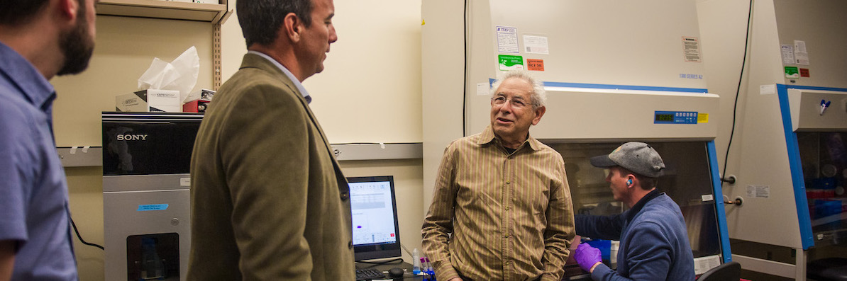 Dr. Blumenthal in the lab with three other researchers.